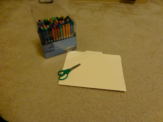 Start with scissors, thin cardboard or cardstock, and markers or colored pencils.