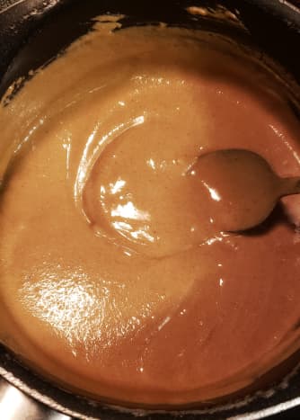 Cook peanut butter, brown sugar, and vanilla over medium heat until smooth.