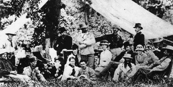 Custer, his men and their wives picknicking in South Dakota just weeks before the Battle of the Little Bighorn. I Company Commander Miles Keough (back row, center left) was one of those who would perish. 