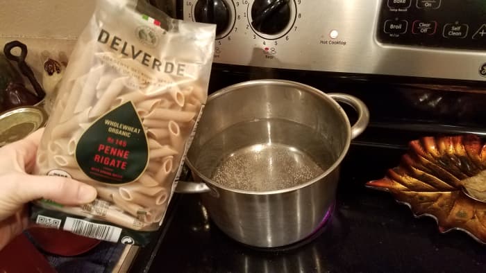 Fill a medium pot with water and boil your chosen noodles over medium-high heat until they cut easily with a fork. We love this dish but rarely have fettuccine noodles, so tonight we used penne.