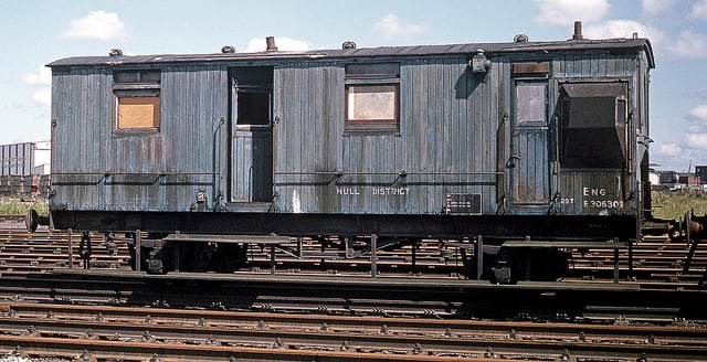 Early 'matchboard'  North Eastern ballast brake van at Alexandra Dock Hull awaiting scrapping or preservation - one stands on the sidings at Goathland behind 'Up' platform