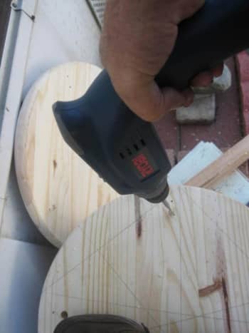 Be careful to maintain the power drill as straight as possible perpendicular to the board's surface.