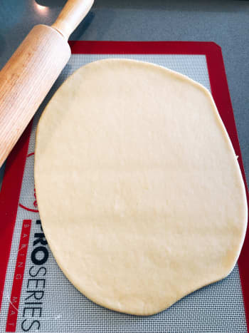 Using a rolling pin, roll the dough to your preferred thickness. 