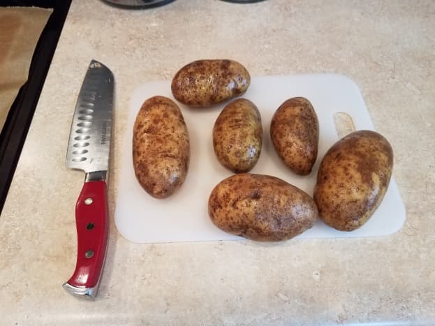 Wash and slice 6 potatoes into 1/8ths.