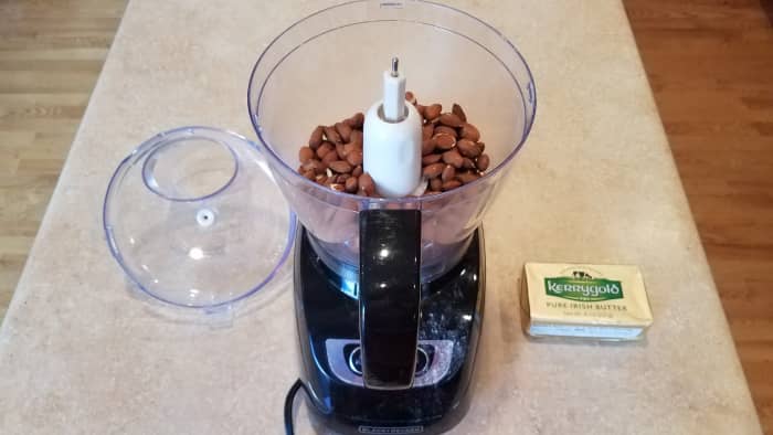 Start by blending up your almonds in the food processor.