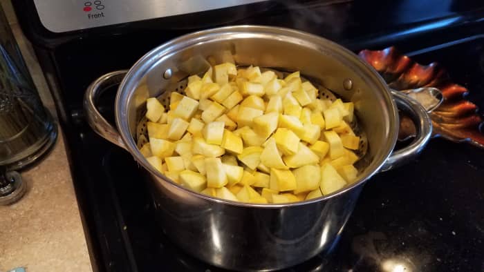 Start by chopping and steaming your squash on the stove for about 20 minutes (in a steamer basket or a little water in the bottom of a pot).