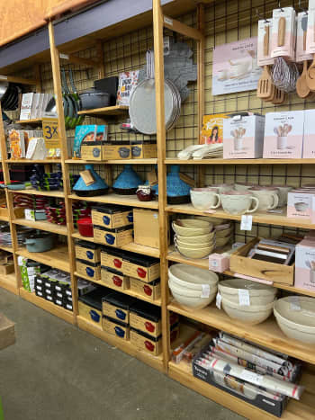 Assorted kitchen ware and tools from pots, pans, mixing bowls, spatulas, and more 