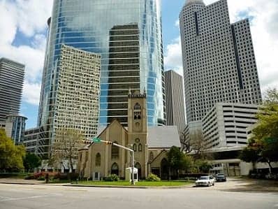 Church with the tall buildings as a backdrop in downtown Houston, Texas