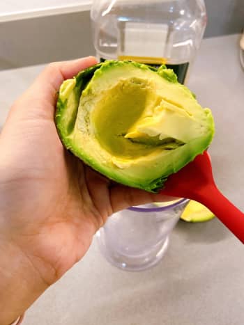 Use a spoon or spatula to scoop the flesh out and transfer it to a blender.