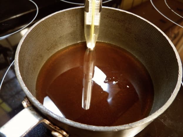 Put pure maple syrup in a saucepan with a candy thermometer. Prepare ice in a heat-resistant bowl (I used a pie plate).