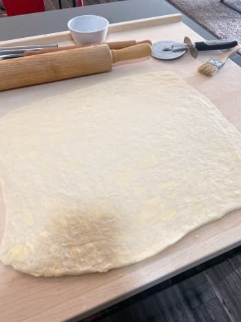 Take the chilled dough from the fridge and turn it out on a baking mat or floured surface. 