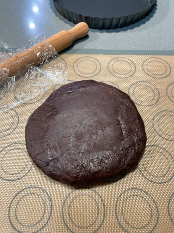 Take the chilled crust out from the fridge. Knead the chocolate pastry dough once or twice on a lightly floured (I used a baking mat) work surface to soften. 