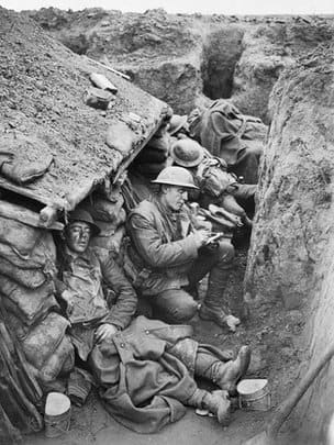 Canadian soldiers in the trenches writing letters home