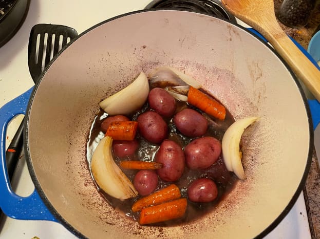 I like to layer my veggies and my chuck roast. I feel that the veggies cook more evenly and my roast isn't swimming in the hot broth. 