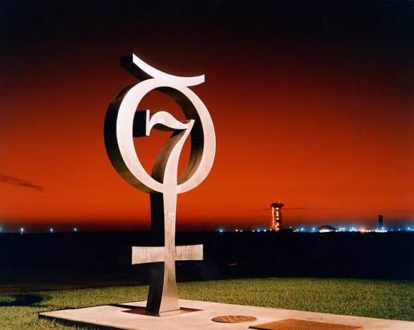 This is a sunrise shot of the Project Mercury Monument that honors the original seven Mercury Astronauts at Pad 14, Cape Canaveral USAF Station. A time capsule is buried beneath the concrete slab.