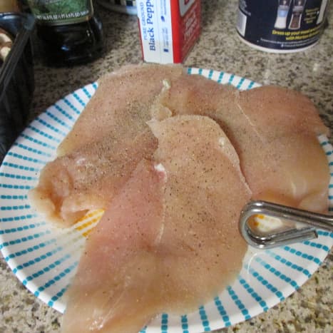 Chicken fillets seasoned with salt and pepper