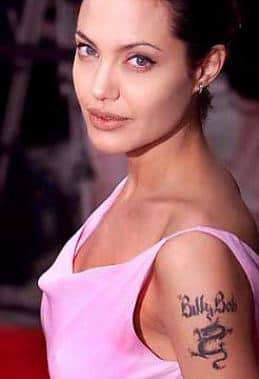 Originally, Angelina had a dragon on her left upper arm. Then she added, &quot;Billie Bob&quot; for her second husband. Both have since been covered. 