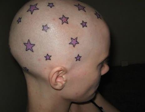 tattooed stars on a person's head