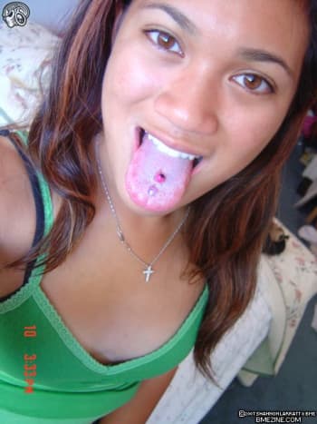 Woman with a double center tongue piercing