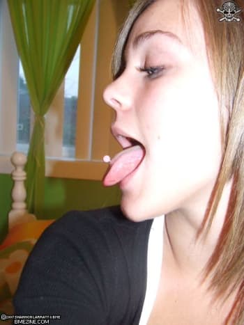 Woman with a standard tongue piercing