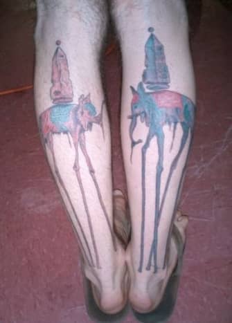 Tattoo of tall elephants inspired by Salvador Dali