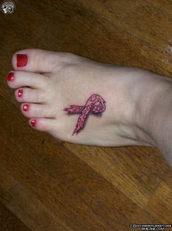 Pink ribbon tattoo on foot.