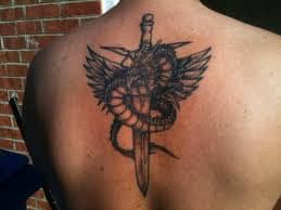 A tattoo of a sword and a winged dragon.