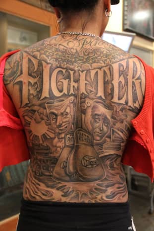An elaborate and detailed design that covers this tattoo enthusiast's entire back.