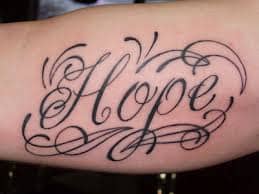 Stylized &quot;hope&quot; tattoo.