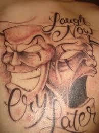 The crying face is particularly expressive in this tattoo.