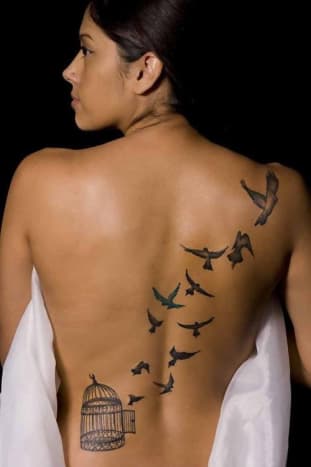 A caged bird tattoo.