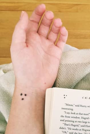 Book page stars tattoo