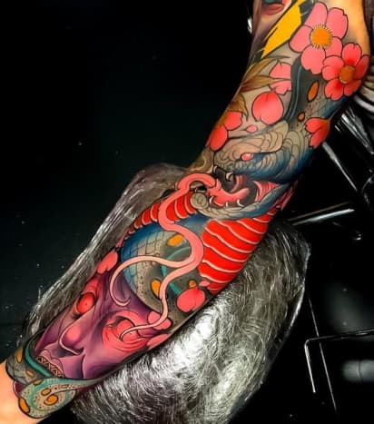 Colorful Japanese snake tattoo by Dan Arietti.