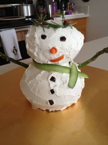 Cheese ball snowman with rosemary crown