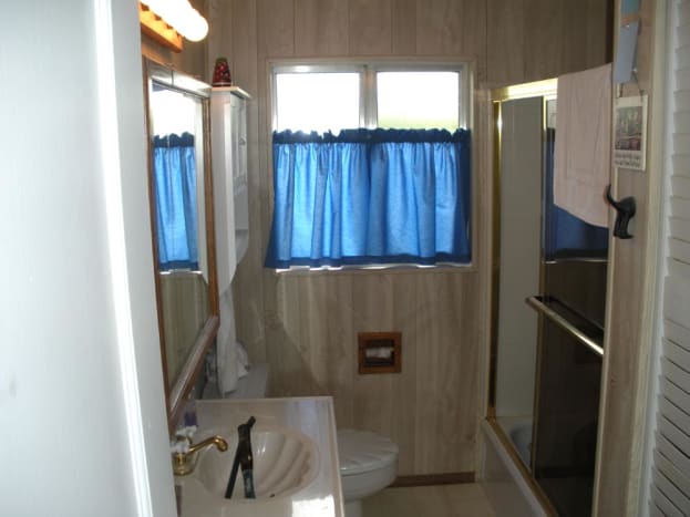 The original appearance of the bathroom, from doorway looking in