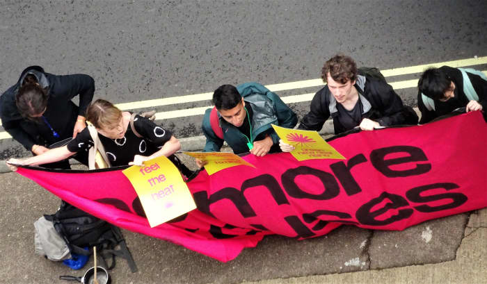 Young protesters outside InterContinental Hotel London Park Lane.