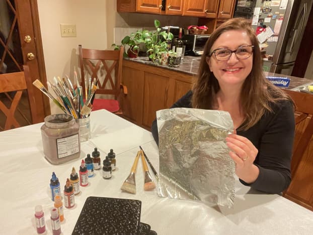 Photo of me with my supplies, getting started to create painted tin foil.