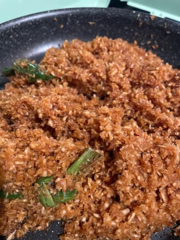 In a pan, throw in palm sugar, water, white granulated sugar, flour, and shredded coconut. Cook until sugar is dissolved. 