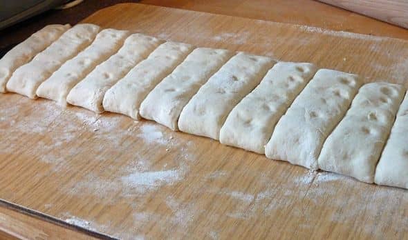 Cut the dough across into 2.5- 3cm wide strips