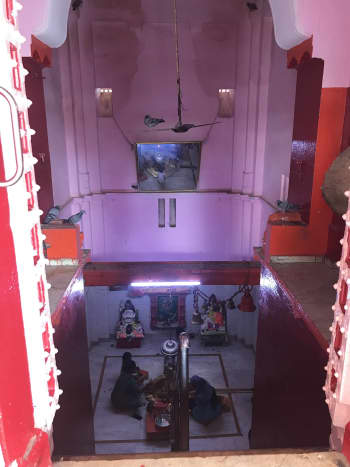 The KaamNaath Mahadev Shrine, located about seven feet below the ground level .... For devotees who cannot climb down the stairs, a mirror is place above, which gives them clear view of the shrine below ....
