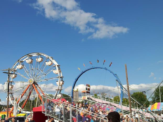 Ferris wheel and other rides at a fair. 