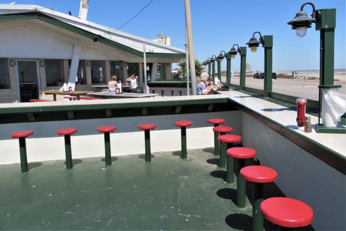 View of the exterior patio seating at Benno's Cajun Seafood