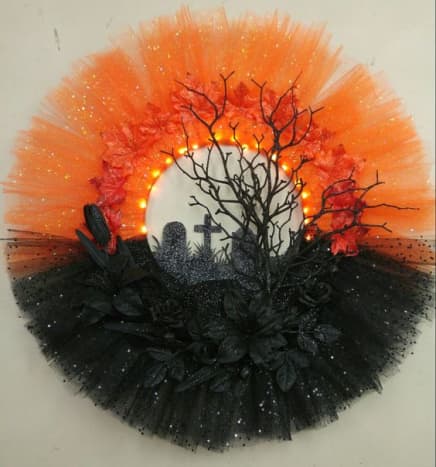 A lighted tulle wreath will really brighten your door throughout fall