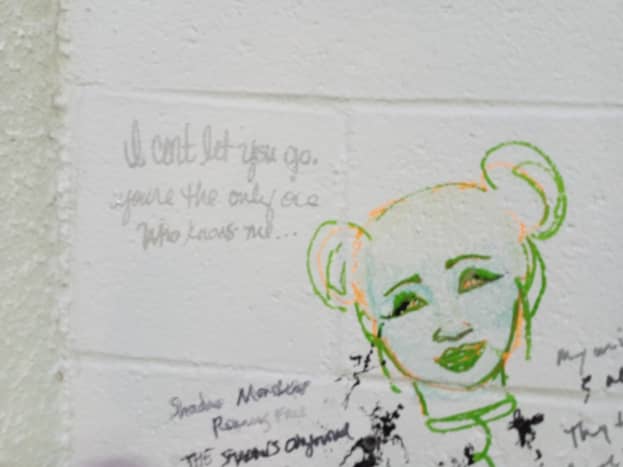 graffiti on a wall offers art and poetry