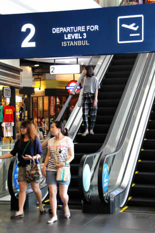 The 'departure' sign for Istanbul, though these shoppers have just arrived down from the Turkish souk to shop in London!