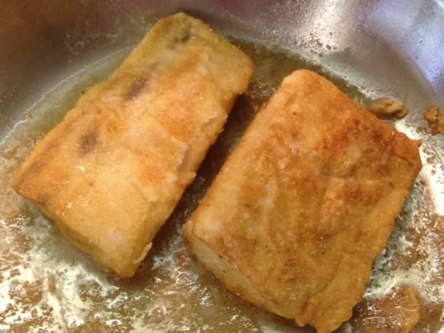Fish dusted in a mixture of flour and corn meal, then pan fried in a little oil, in a well seasoned pan. 