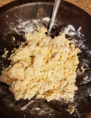 Combine flour, sugar, and salt in a large mixing bowl. Using your hands, add the butter into the mix, crumbling it as you go. Mix it in well with your hands. It should look like this.