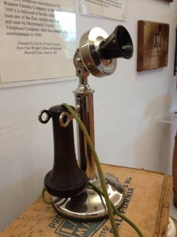 Although not visible here, the candlestick phone still required a ringer box and batteries to work.