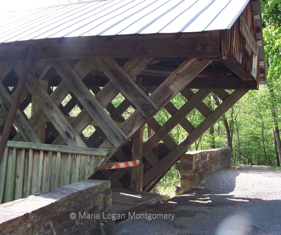 This is a side view near the entrance of the bridge, showing the pretty lattice-pattern used by the builder, Mr. Thurman Horton, in 1894.
