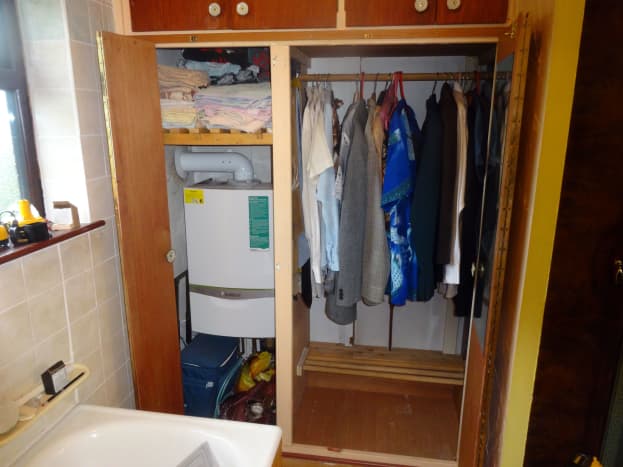Newly resized airing cupboard and adjoining wardrobe in the bathroom.
